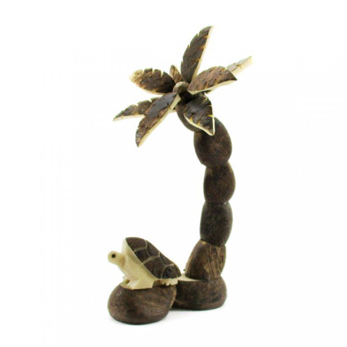 sculpture en ivoire végétal avec palmier et tortue